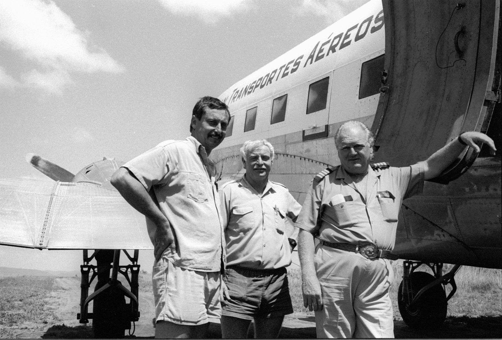 Mozambique, Sofala province, Marínguè. November 1993. The crew of Scan Air DC-3 (registration number: C/N 19006 C9-STE) during an airlift of emergency goods for displaced population. From left to right: Brian Nordan, John Murphy and chief pilot and Scan Air CEO Oscar Hermannson. The same team fatally crashed with this Douglas DC-3 near Molema in Tete province on 22 November 1993. Only John Murphy survived.