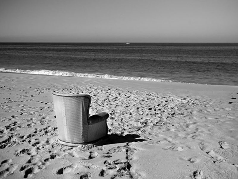 Portugal, Alentejo, Comporta. 'My favourite chair' on the beach of Torre, facing the Atlantic Ocean