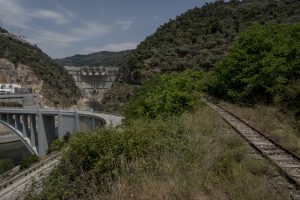 Portugal, Alto Douro, near the village of Tua. 2017. Part of the abandoned Tua railway line next to the completed Foz Tua Dam. Its storage reservoir is submerging a bigger part of this historic railroad that was built in 1887.