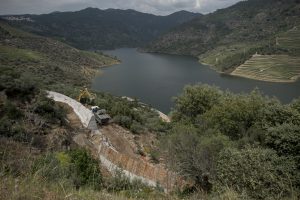 Portugal, Alto Douro, near the village of Tua. 2017. The storage reservoir of the Foz Tua dam that has completely submerged the historic Tua railway. A mooring is under construction to promote tourism (sic).